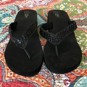 Black rhinestone flip flops